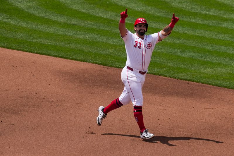 Jun 8, 2025; Cincinnati, Ohio, USA; Cincinnati Reds first baseman Christian Encarnacion-Strand (33) gestures as he runs the bases after hitting a solo home run against the Arizona Diamondbacks in the fourth inning at Great American Ball Park. Mandatory Credit: Aaron Doster-Imagn Images