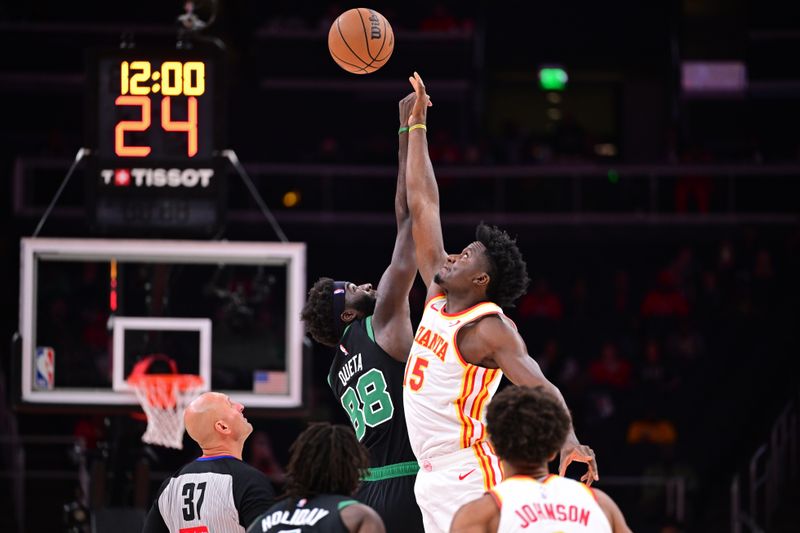 ATLANTA, GA - NOVEMBER 4: Neemias Queta #88 of the Boston Celtics and Clint Capela #15 of the Atlanta Hawks go for the opening tip-off during the game on November 4, 2024 at State Farm Arena in Atlanta, Georgia.  NOTE TO USER: User expressly acknowledges and agrees that, by downloading and/or using this Photograph, user is consenting to the terms and conditions of the Getty Images License Agreement. Mandatory Copyright Notice: Copyright 2024 NBAE (Photo by Adam Hagy/NBAE via Getty Images)