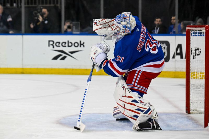 Mar 20, 2025; New York, New York, USA;  New York Rangers goaltender Igor Shesterkin (31) attempts a pass against the Toronto Maple Leafs during the first period at Madison Square Garden. Mandatory Credit: Dennis Schneidler-Imagn Images