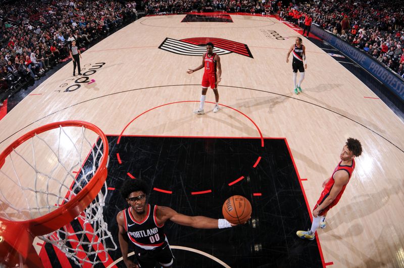 PORTLAND, OR - APRIL 9: Scoot Henderson #00 of the Portland Trail Blazers drives to the basket during the game against the New Orleans Pelicans on April 9, 2024 at the Moda Center Arena in Portland, Oregon. NOTE TO USER: User expressly acknowledges and agrees that, by downloading and or using this photograph, user is consenting to the terms and conditions of the Getty Images License Agreement. Mandatory Copyright Notice: Copyright 2024 NBAE (Photo by Cameron Browne/NBAE via Getty Images)