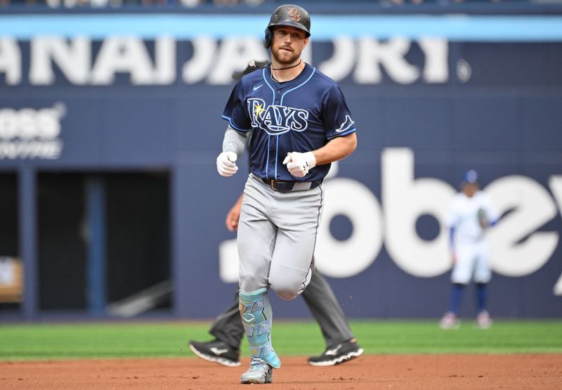 Jul 25, 2024; Toronto, Ontario, CAN; Tampa Bay Rays designated hitter Brandon Lowe (8) rounds the bases after hitting a solo home run against the Toronto Blue Jays in the first inning at Rogers Centre. Mandatory Credit: Dan Hamilton-USA TODAY Sports