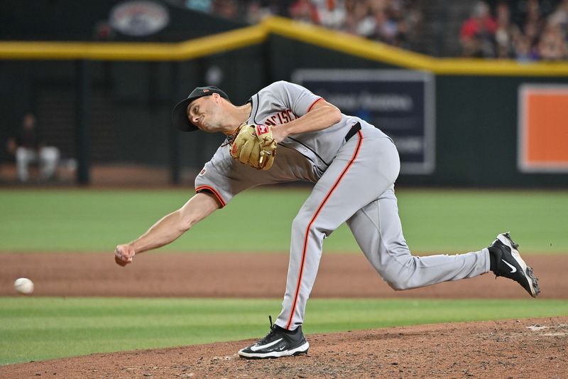 Jun 30, 2025; Phoenix, Arizona, USA;  San Francisco Giants pitcher Tyler Rogers (71) throws in the eighth inning against the Arizona Diamondbacks at Chase Field. Mandatory Credit: Matt Kartozian-Imagn Images