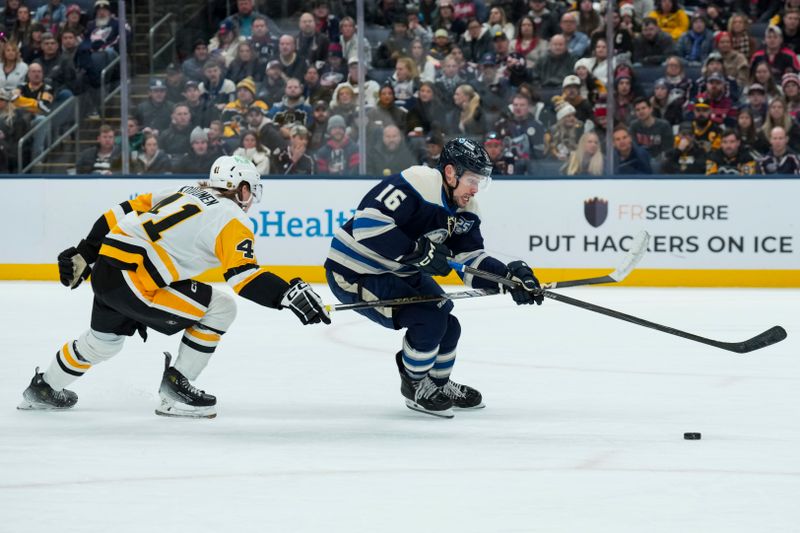 Nov 28, 2025; Columbus, Ohio, USA;  Columbus Blue Jackets center Brendan Gaunce (16) skates with the puck against Pittsburgh Penguins right wing Ville Koivunen (41) in the first period at Nationwide Arena. Mandatory Credit: Aaron Doster-Imagn Images