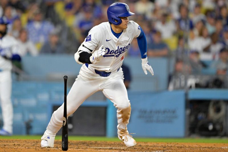 Jun 21, 2024; Los Angeles, California, USA;  Los Angeles Dodgers designated hitter Shohei Ohtani (17) runs out an infield hit in the eighth inning against the Los Angeles Angels at Dodger Stadium. Mandatory Credit: Jayne Kamin-Oncea-USA TODAY Sports