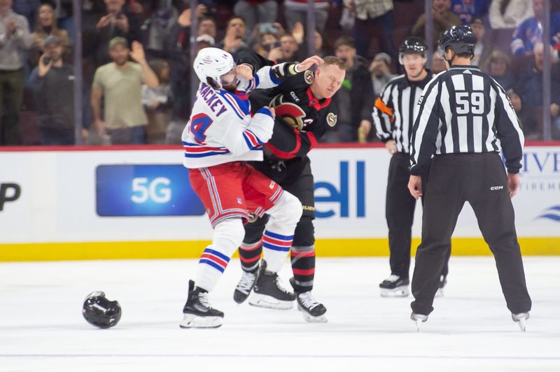 Jan 27, 2024; Ottawa, Ontario, CAN; New York Rangers defenseman Connor Mackey (14) fights with Ottawa Senators left wing Brady Tkachuk (7) in the second period at the Canadian Tire Centre. Mandatory Credit: Marc DesRosiers-USA TODAY Sports