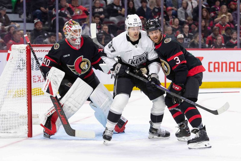Oct 14, 2024; Ottawa, Ontario, CAN; Los Angeles Kings left wing Warren Foegele (37) battles for position with Ottawa Senators defenseman Nick Jensen (3) as they stand in front of goalie Mads Sogaard (40) in the second period at the Canadian Tire Centre. Mandatory Credit: Marc DesRosiers-Imagn Images