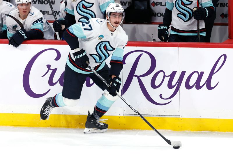 Oct 23, 2025; Winnipeg, Manitoba, CAN; Seattle Kraken left wing Mason Marchment (27) skates up the ice in a game against the Winnipeg Jets in the third period at Canada Life Centre. Mandatory Credit: James Carey Lauder-Imagn Images