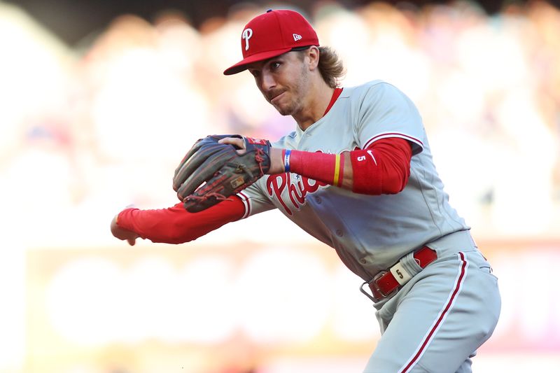 Oct 7, 2023; Cumberland, Georgia, USA; Philadelphia Phillies second baseman Bryson Stott (5) fields a ball during the first inning against the Atlanta Braves during game one of the NLDS for the 2023 MLB playoffs at Truist Park. Mandatory Credit: Brett Davis-USA TODAY Sports