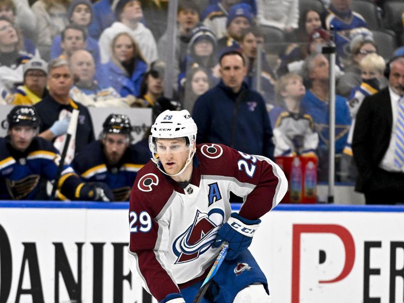 Dec 29, 2023; St. Louis, Missouri, USA;  Colorado Avalanche center Nathan MacKinnon (29) controls the puck against the St. Louis Blues during the third period at Enterprise Center. Mandatory Credit: Jeff Curry-USA TODAY Sports