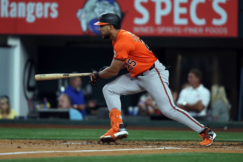 Jul 20, 2024; Arlington, Texas, USA; Baltimore Orioles designated hitter Anthony Santander (25) drives in a run with a single against the Texas Rangers in the second inning at Globe Life Field. Mandatory Credit: Tim Heitman-USA TODAY Sports