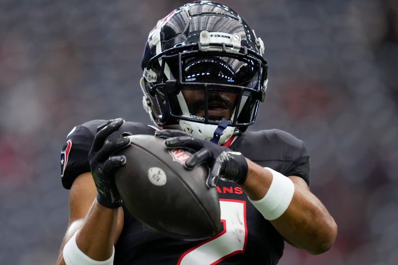 Houston Texans wide receiver Robert Woods (2) warms up before an NFL football game against the Tennessee Titans, Sunday, Nov. 24, 2024, in Houston. (AP Photo/Ashley Landis)