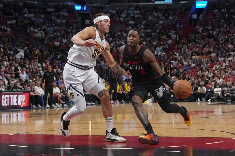 MIAMI, FL - MARCH 13: Terry Rozier #2 of the Miami Heat dribbles the ball during the game against the Denver Nuggets on March 13, 2024 at Kaseya Center in Miami, Florida. NOTE TO USER: User expressly acknowledges and agrees that, by downloading and or using this Photograph, user is consenting to the terms and conditions of the Getty Images License Agreement. Mandatory Copyright Notice: Copyright 2024 NBAE (Photo by Eric Espada/NBAE via Getty Images)