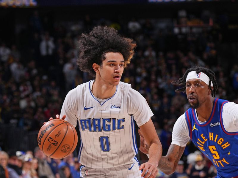 DENVER, CO - JANUARY 5: Anthony Black #0 of the Orlando Magic dribbles the ball during the game against the Denver Nuggets on January 5, 2024 at the Ball Arena in Denver, Colorado. NOTE TO USER: User expressly acknowledges and agrees that, by downloading and/or using this Photograph, user is consenting to the terms and conditions of the Getty Images License Agreement. Mandatory Copyright Notice: Copyright 2024 NBAE (Photo by Bart Young/NBAE via Getty Images)