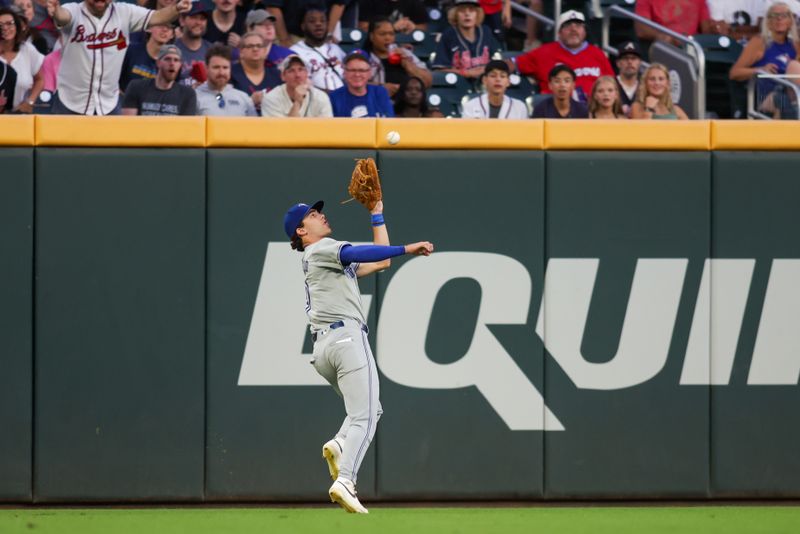 Sep 7, 2024; Atlanta, Georgia, USA; Toronto Blue Jays left fielder Joey Loperfido (9) catches a fly ball against the Atlanta Braves in the second inning at Truist Park. Mandatory Credit: Brett Davis-Imagn Images