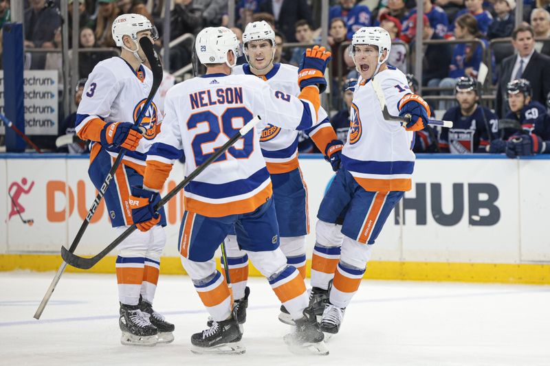 Mar 17, 2024; New York, New York, USA; New York Islanders center Bo Horvat (14) celebrates his goal with teammates during the first period against the New York Rangers at Madison Square Garden. Mandatory Credit: Vincent Carchietta-USA TODAY Sports