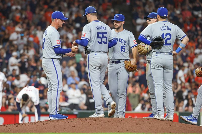Aug 31, 2024; Houston, Texas, USA; Kansas City Royals starting pitcher Cole Ragans (55) hands the ball to manager Matt Quatraro (33) during a pitching change in the sixth inning against the Houston Astros at Minute Maid Park. Mandatory Credit: Troy Taormina-USA TODAY Sports