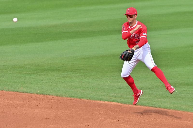 Mar 6, 2024; Tempe, Arizona, USA;  Los Angeles Angels shortstop Zach Neto (9) throws to first base in the second inning against the Oakland Athletics during a spring training game at Tempe Diablo Stadium. Mandatory Credit: Matt Kartozian-USA TODAY Sports