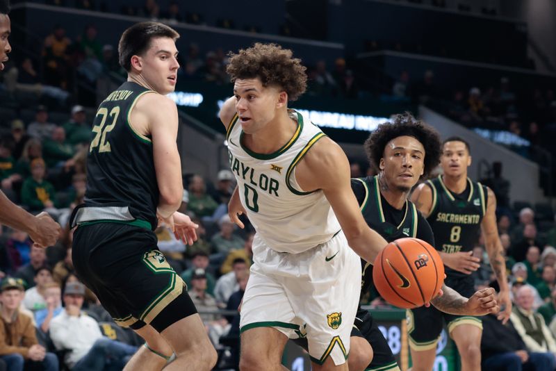 Dec 2, 2025; Waco, Texas, USA;  Baylor Bears guard Dan Skillings Jr. (0) drives to the basket around Sacramento State Hornets forward Mark Lavrenov (32) during the first half at Paul and Alejandra Foster Pavilion. Mandatory Credit: Chris Jones-Imagn Images