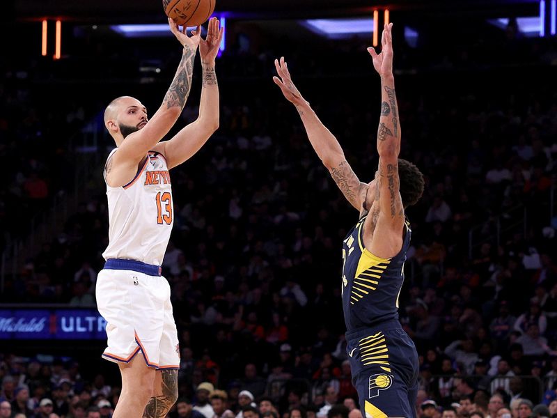 NEW YORK, NEW YORK - APRIL 09:  Evan Fournier #13 of the New York Knicks takes a shot as George Hill #7 of the Indiana Pacers defends at Madison Square Garden on April 09, 2023 in New York City. NOTE TO USER: User expressly acknowledges and agrees that, by downloading and or using this photograph, User is consenting to the terms and conditions of the Getty Images License Agreement. (Photo by Elsa/Getty Images)