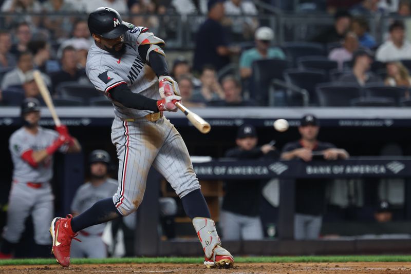 Aug 13, 2025; Bronx, New York, USA;  Minnesota Twins center fielder Byron Buxton (25) singles during the sixth inning against the New York Yankees at Yankee Stadium. Mandatory Credit: Vincent Carchietta-Imagn Images