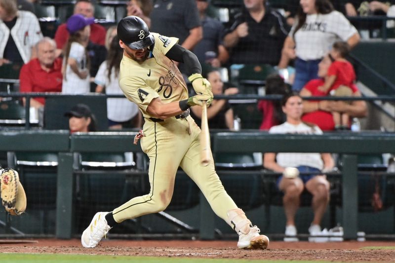 Jun 4, 2024; Phoenix, Arizona, USA;  Arizona Diamondbacks shortstop Blaze Alexander (9) singles in the seventh inning against the San Francisco Giants at Chase Field. Mandatory Credit: Matt Kartozian-USA TODAY Sports