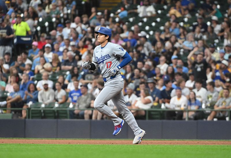 Aug 12, 2024; Milwaukee, Wisconsin, USA; Los Angeles Dodgers two-way player Shohei Ohtani (17) rounds the bases after hitting a home run agains the Milwaukee Brewers in the fifth inning at American Family Field. Mandatory Credit: Michael McLoone-USA TODAY Sports