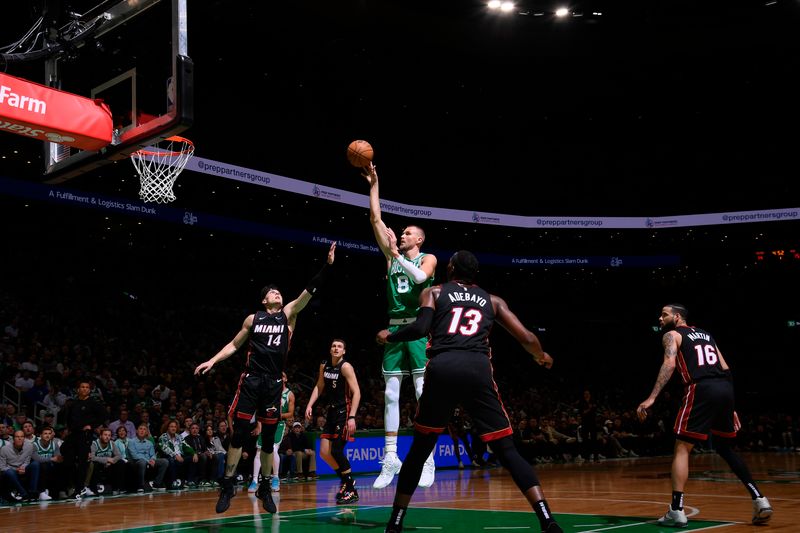 BOSTON, MA - APRIL 24: Kristaps Porzingis #8 of the Boston Celtics goes to the basket during the game against the Miami Heat during Round 1 Game 2 of the 2024 NBA Playoffs on April 24, 2024 at the TD Garden in Boston, Massachusetts. NOTE TO USER: User expressly acknowledges and agrees that, by downloading and or using this photograph, User is consenting to the terms and conditions of the Getty Images License Agreement. Mandatory Copyright Notice: Copyright 2024 NBAE  (Photo by Brian Babineau/NBAE via Getty Images)