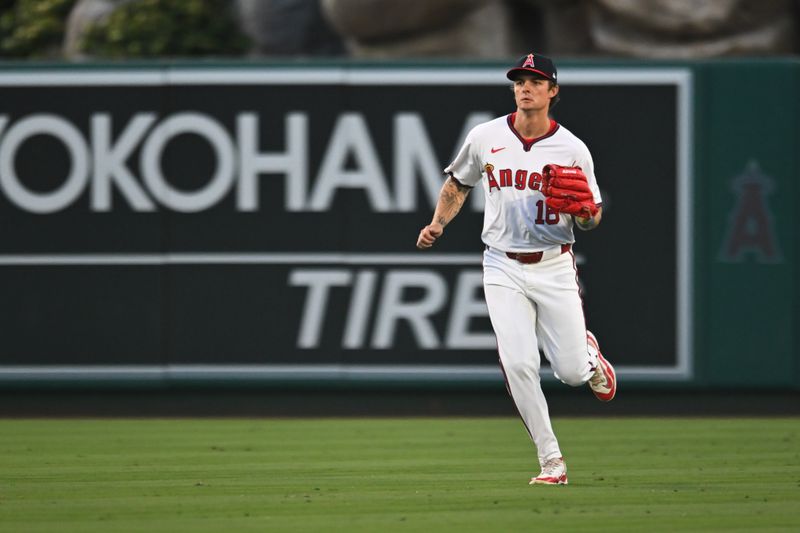Jul 27, 2024; Anaheim, California, USA; Los Angeles Angels first baseman Nolan Schanuel (18) fields a ball against the Oakland Athletics during the fifth inning at Angel Stadium. Mandatory Credit: Jonathan Hui-USA TODAY Sports