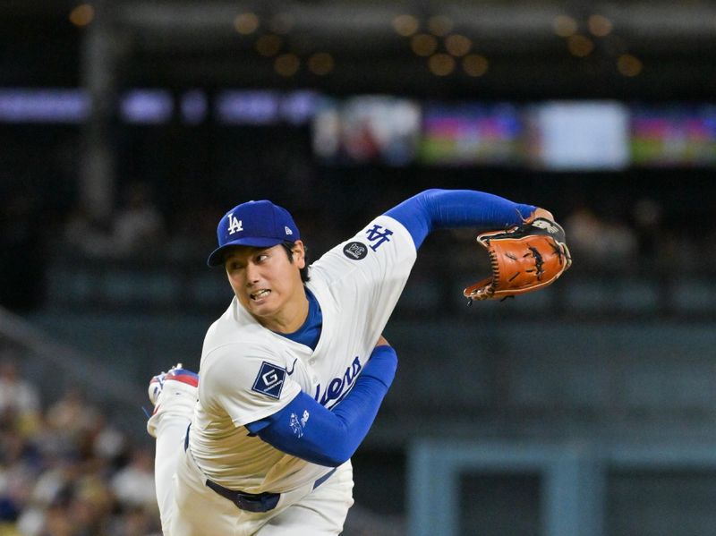 Sep 16, 2025; Los Angeles, California, USA; Los Angeles Dodgers designated hitter Shohei Ohtani (17) delivers a pitch during the first inning against the Philadelphia Phillies at Dodger Stadium. Mandatory Credit: Jayne Kamin-Oncea-Imagn Images