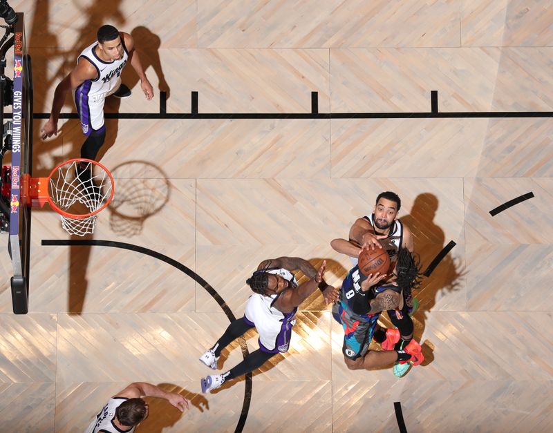 BROOKLYN, NY - APRIL 7: Trey Lyles #41 of the Sacramento Kings blocks the shot of Trendon Watford #9 of the Brooklyn Nets on April 7, 2024 at Barclays Center in Brooklyn, New York. NOTE TO USER: User expressly acknowledges and agrees that, by downloading and or using this Photograph, user is consenting to the terms and conditions of the Getty Images License Agreement. Mandatory Copyright Notice: Copyright 2024 NBAE (Photo by Nathaniel S. Butler/NBAE via Getty Images)