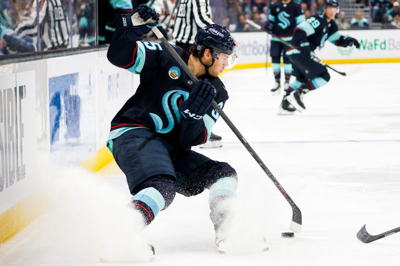 Jan 4, 2024; Seattle, Washington, USA; Seattle Kraken left wing Andre Burakovsky (95) skates with the puck against the Ottawa Senators during the second period at Climate Pledge Arena. Mandatory Credit: Joe Nicholson-USA TODAY Sports