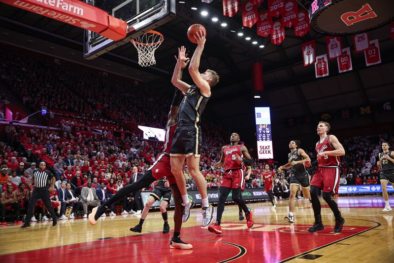 Jan 28, 2024; Piscataway, New Jersey, USA; Purdue Boilermakers forward Caleb Furst (1) shoots the ball as Rutgers Scarlet Knights center Clifford Omoruyi (11) defends during the first half at Jersey Mike's Arena. Mandatory Credit: Vincent Carchietta-USA TODAY Sports