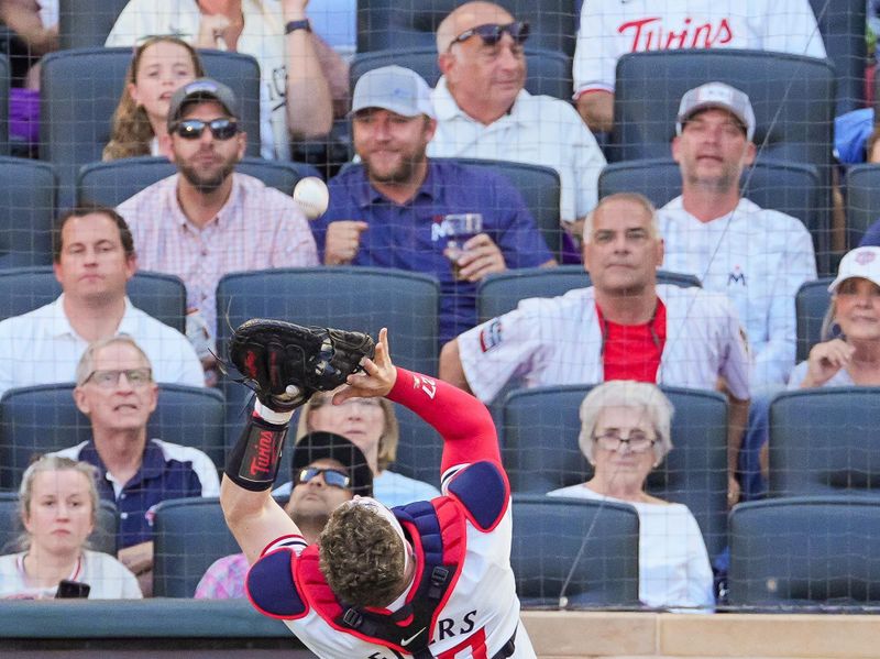 Jun 13, 2024; Minneapolis, Minnesota, USA; Minnesota Twins catcher Ryan Jeffers (27) fields a fly ball against the Oakland Athletics in the sixth inning at Target Field. Mandatory Credit: Brad Rempel-USA TODAY Sports