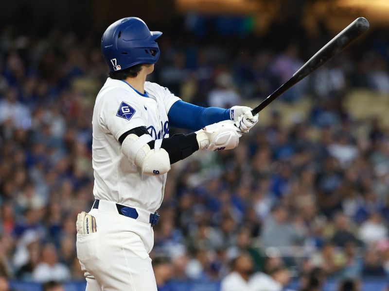 May 17, 2024; Los Angeles, California, USA;  Los Angeles Dodgers designated hitter Shohei Ohtani (17) hits a home run during the third inning against the Cincinnati Reds at Dodger Stadium. Mandatory Credit: Kiyoshi Mio-USA TODAY Sports