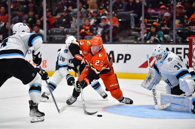 Oct 16, 2024; Anaheim, California, USA; Anaheim Ducks center Mason McTavish (23) moves in for a shot against Utah Hockey Club goaltender Connor Ingram (39) during the second period at Honda Center. Mandatory Credit: Gary A. Vasquez-Imagn Images