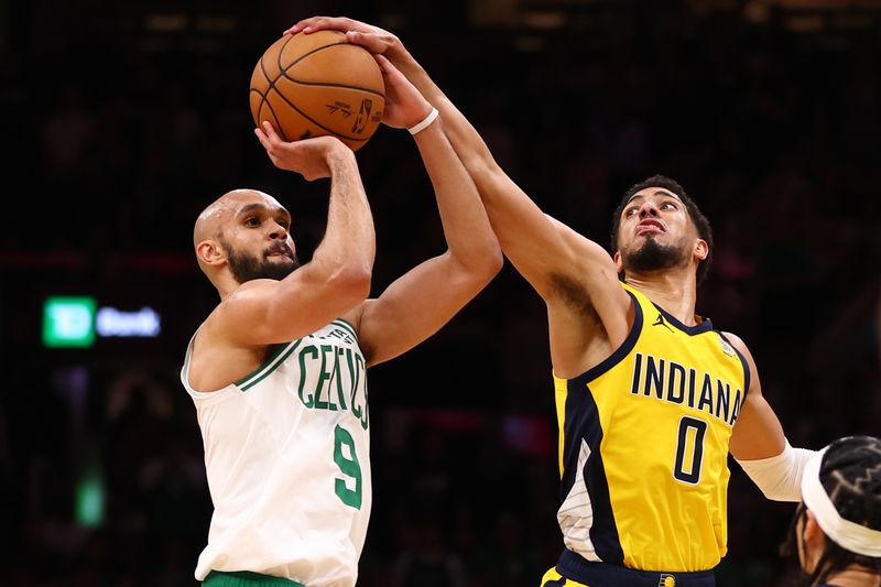 BOSTON, MASSACHUSETTS - MAY 21: Tyrese Haliburton #0 of the Indiana Pacers defends against Derrick White #9 of the Boston Celtics during the fourth quarter in Game One of the Eastern Conference Finals at TD Garden on May 21, 2024 in Boston, Massachusetts. NOTE TO USER: User expressly acknowledges and agrees that, by downloading and or using this photograph, User is consenting to the terms and conditions of the Getty Images License Agreement. (Photo by Maddie Meyer/Getty Images)