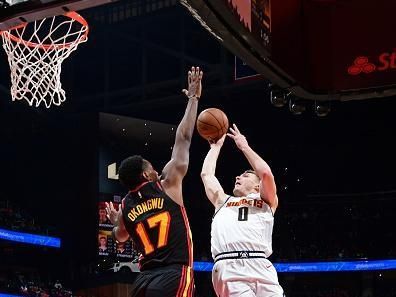 ATLANTA, GA - DECEMBER 11: Christian Braun #0 of the Denver Nuggets shoots the ball during the game against the Atlanta Hawks on December 11, 2023 at State Farm Arena in Atlanta, Georgia.  NOTE TO USER: User expressly acknowledges and agrees that, by downloading and/or using this Photograph, user is consenting to the terms and conditions of the Getty Images License Agreement. Mandatory Copyright Notice: Copyright 2023 NBAE (Photo by Scott Cunningham/NBAE via Getty Images)