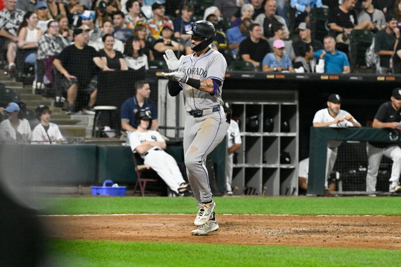 Jun 27, 2024; Chicago, Illinois, USA;  Colorado Rockies outfielder Brenton Doyle (9) claps after hitting a two-run home run against the Chicago White Sox during the sixth inning at Guaranteed Rate Field. Mandatory Credit: Matt Marton-USA TODAY Sports