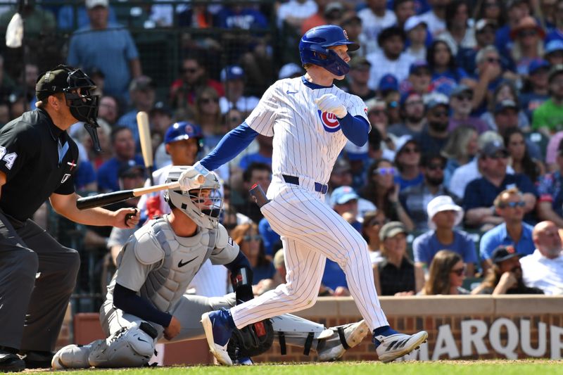 Aug 22, 2024; Chicago, Illinois, USA; Chicago Cubs center fielder Pete Crow-Armstrong (52) hits a two-run double during the seventh inning against the Detroit Tigers at Wrigley Field. Mandatory Credit: Patrick Gorski-USA TODAY Sports