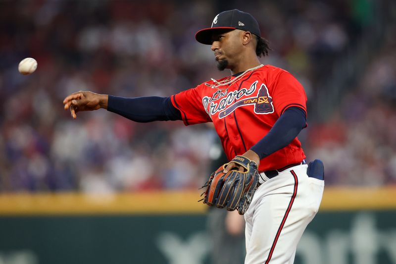 Sep 28, 2023; Atlanta, Georgia, USA; Atlanta Braves second baseman Ozzie Albies (1) throws a runner out at first against the Chicago Cubs in the second inning at Truist Park. Mandatory Credit: Brett Davis-USA TODAY Sports
