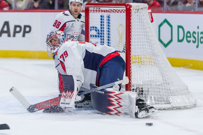 Jan 30, 2025; Ottawa, Ontario, CAN; Washington Capitals goalie Charlie Lindgren (79) makes a save in the first period against the  Ottawa Senators at the Canadian Tire Centre. Mandatory Credit: Marc DesRosiers-Imagn Images