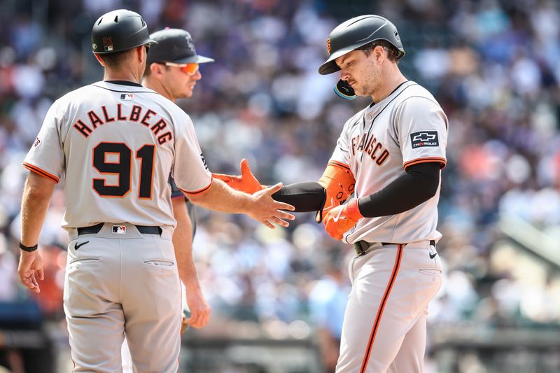 May 25, 2024; New York City, New York, USA;  San Francisco Giants designated hitter Patrick Bailey (14) is greeted by first base coach Mark Hallberg (91) after hitting a game tying RBI single in the sixth inning against the New York Mets at Citi Field. Mandatory Credit: Wendell Cruz-USA TODAY Sports