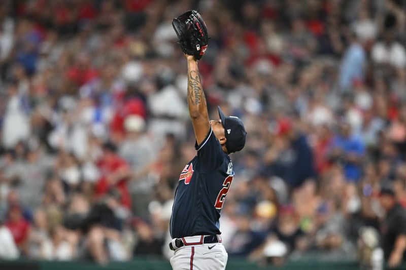 Jul 3, 2023; Cleveland, Ohio, USA; Atlanta Braves relief pitcher Raisel Iglesias (26) celebrates after the Braves beat the Cleveland Guardians at Progressive Field. Mandatory Credit: Ken Blaze-USA TODAY Sports