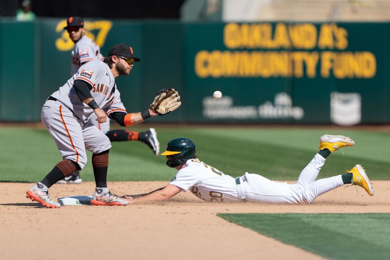 Aug 6, 2023; Oakland, California, USA;  Oakland Athletics second baseman Zack Gelof (20) slides in safe during the seventh inning against San Francisco Giants shortstop Brandon Crawford (35) at Oakland-Alameda County Coliseum. Mandatory Credit: Stan Szeto-USA TODAY Sports