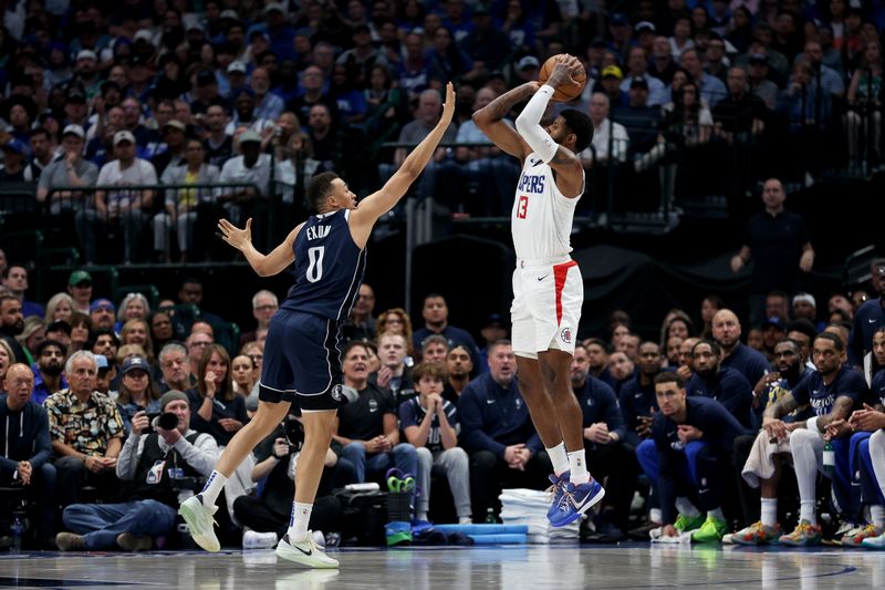 DALLAS, TEXAS - APRIL 28: Paul George #13 of the Los Angeles Clippers shoots the ball while defended by Dante Exum #0 of the Dallas Mavericks in the first half of game four of the Western Conference First Round Playoffs at American Airlines Center on April 28, 2024 in Dallas, Texas.  NOTE TO USER: User expressly acknowledges and agrees that, by downloading and or using this photograph, User is consenting to the terms and conditions of the Getty Images License Agreement. (Photo by Tim Warner/Getty Images)