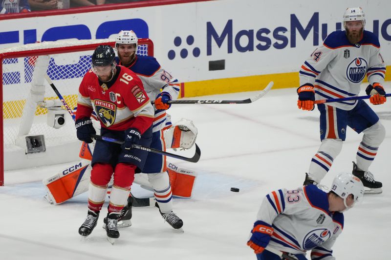 Jun 24, 2024; Sunrise, Florida, USA; Florida Panthers forward Aleksander Barkov (16) defends against Edmonton Oilers forward Connor McDavid (97) during the first period in game seven of the 2024 Stanley Cup Final at Amerant Bank Arena. Mandatory Credit: Jim Rassol-USA TODAY Sports