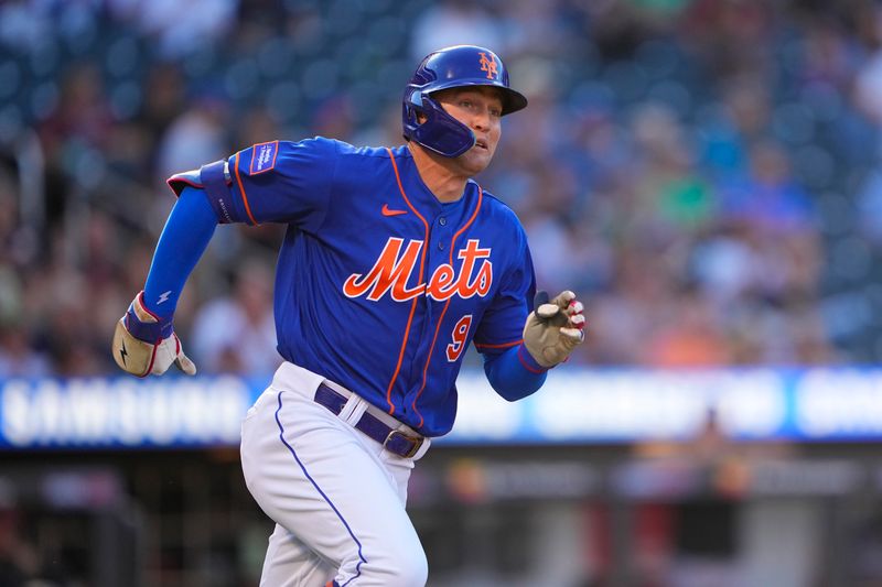 Sep 14, 2023; New York City, New York, USA; New York Mets center fielder Brandon Nimmo (9) runs out a single against the Arizona Diamondbacks during the fifth inning at Citi Field. Mandatory Credit: Gregory Fisher-USA TODAY Sports