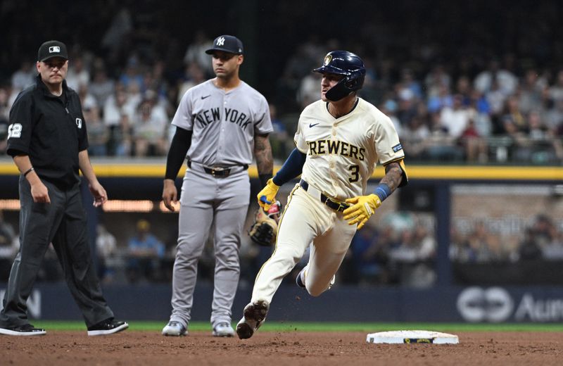 Apr 27, 2024; Milwaukee, Wisconsin, USA; Milwaukee Brewers third base Joey Ortiz (3) hits a double against the New York Yankees in the fifth inning at American Family Field. Mandatory Credit: Michael McLoone-USA TODAY Sports