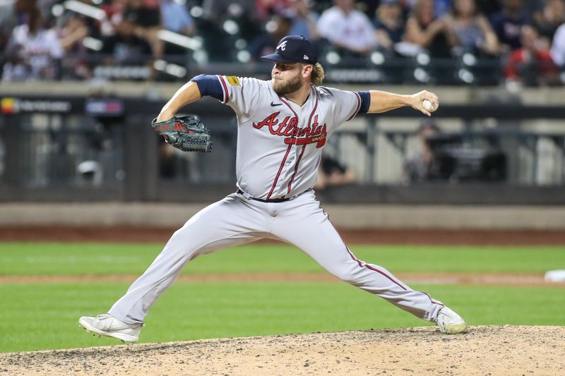 Aug 11, 2023; New York City, New York, USA; Atlanta Braves relief pitcher A.J. Minter (33) pitches in the ninth inning against the New York Mets at Citi Field. Mandatory Credit: Wendell Cruz-USA TODAY Sports