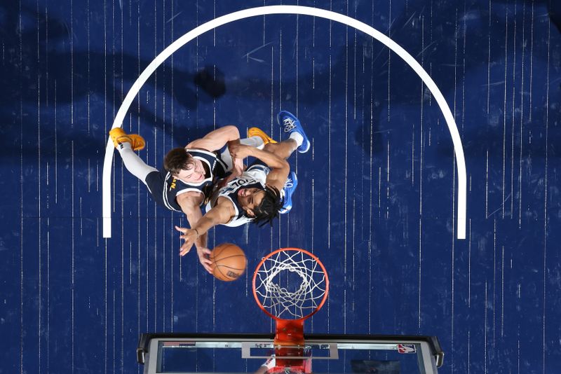 MINNEAPOLIS, MN -  OCTOBER 17: Christian Braun #0 of the Denver Nuggets drives to the basket during the game against the Minnesota Timberwolves during the 2024 NBA Preseason on October 17, 2024 at Target Center in Minneapolis, Minnesota. NOTE TO USER: User expressly acknowledges and agrees that, by downloading and or using this Photograph, user is consenting to the terms and conditions of the Getty Images License Agreement. Mandatory Copyright Notice: Copyright 2024 NBAE (Photo by David Sherman/NBAE via Getty Images)